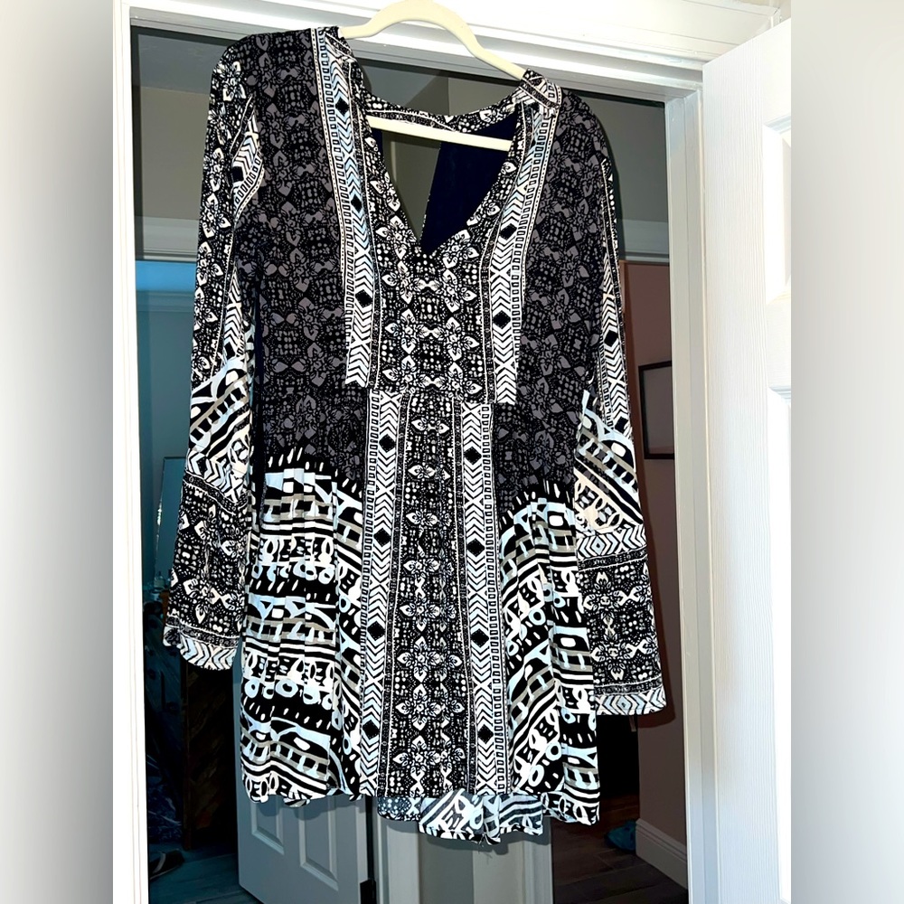 Free people bell sleeve, 3/4 sleeve length with key whole back. Never worn